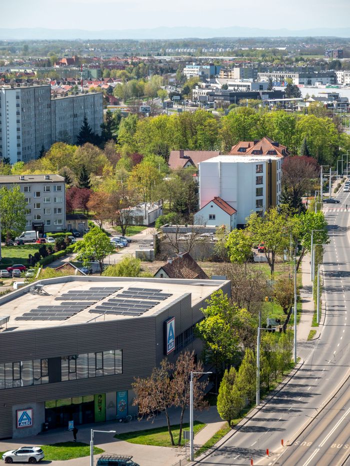 Services Aerial view of Wrocław suburban area with modern and traditional buildings.